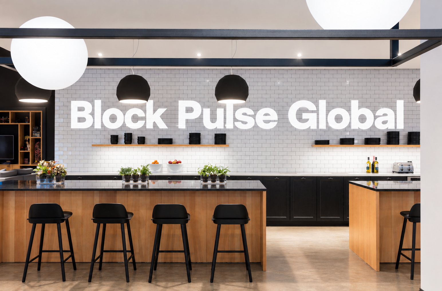The office kitchen bar, with the Block Pulse Global wordmark mounted on the tiled wall above the counter.